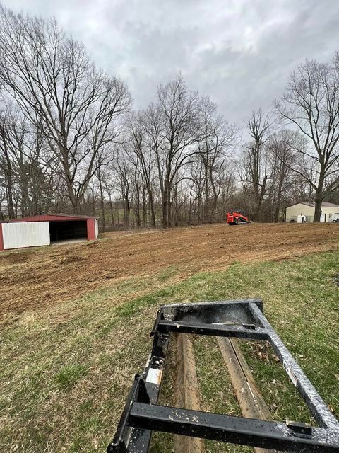 Trailer sitting in the middle of a dirt field with cloudy sky - Campbellsburg, IN | Twisted Electric LLC 