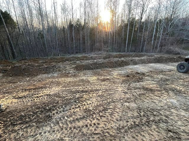 Dirt road in the middle of a forest with trees in the background - Campbellsburg, IN | Twisted Electric LLC 