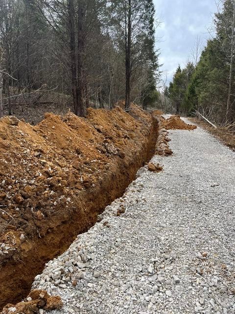 Dirt road with a trench in the middle of it - Campbellsburg, IN | Twisted Electric LLC 