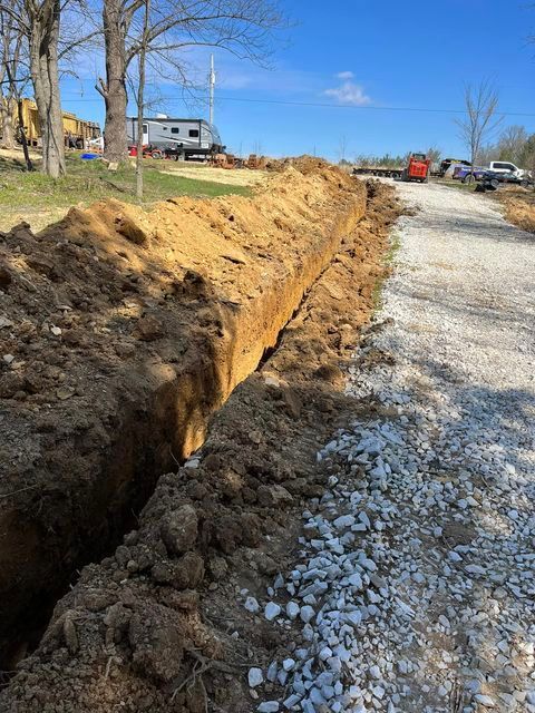 Large pile of dirt sitting on the side of a gravel road - Campbellsburg, IN | Twisted Electric LLC 