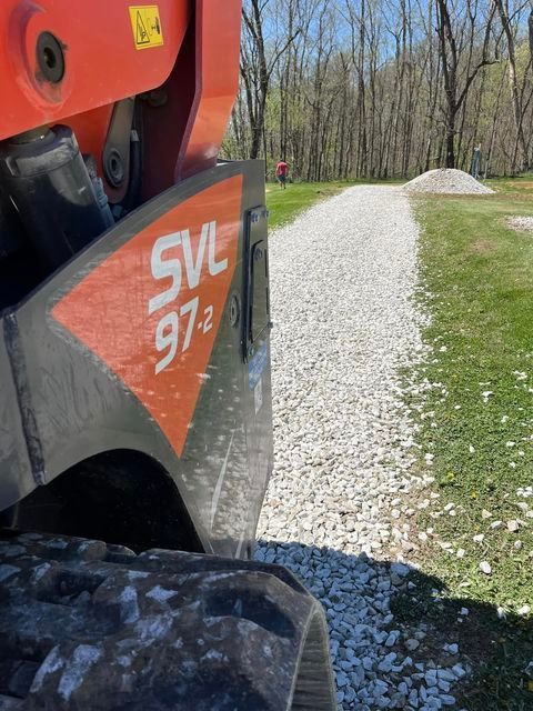 Red and orange excavator parked on a gravel road - Campbellsburg, IN | Twisted Electric LLC 