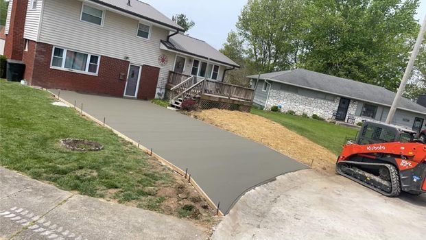 Concrete driveway being built in front of a house - Campbellsburg, IN | Twisted Electric LLC 