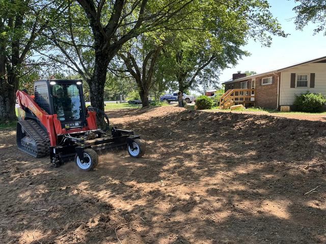 Small bulldozer moving dirt in front of a house - Campbellsburg, IN | Twisted Electric LLC 