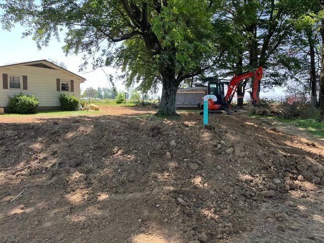 Large pile of dirt sitting in front of a house and red object - Campbellsburg, IN | Twisted Electric LLC 