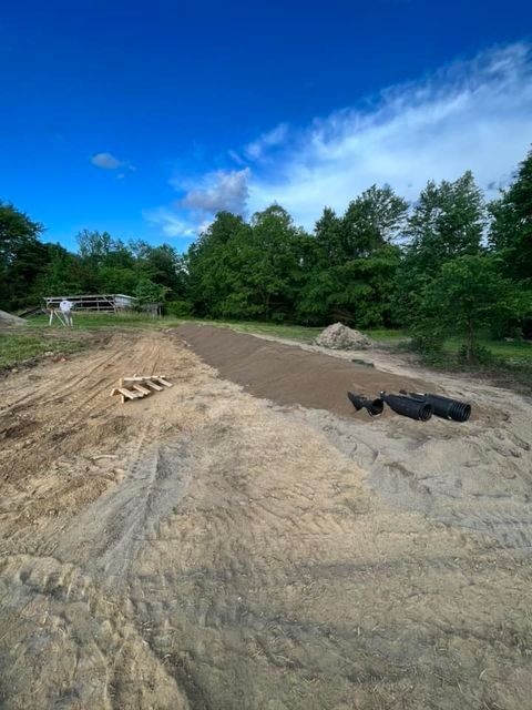 Pair of binoculars sitting on top of a pile of dirt in a field - Campbellsburg, IN | Twisted Electric LLC 