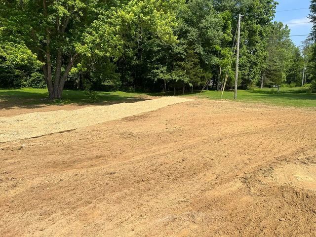 Dirt road going through a field with trees in the background - Campbellsburg, IN | Twisted Electric LLC 