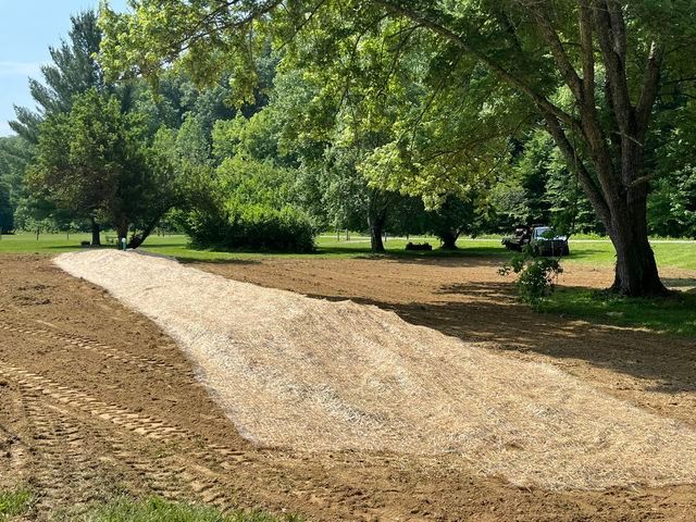 Dirt road being built in a field with trees in the background - Campbellsburg, IN | Twisted Electric LLC 