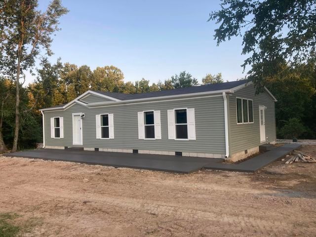 Mobile home sitting in the middle of a dirt field - Campbellsburg, IN | Twisted Electric LLC 