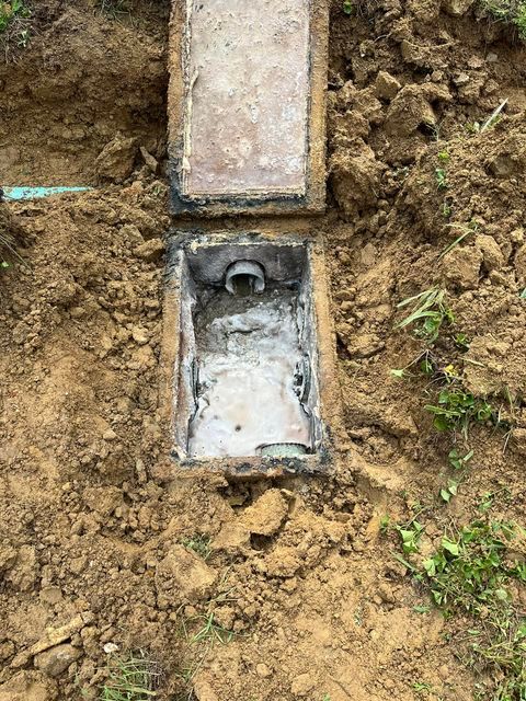 Septic tank sitting in the middle of a dirt field - Campbellsburg, IN | Twisted Electric LLC 