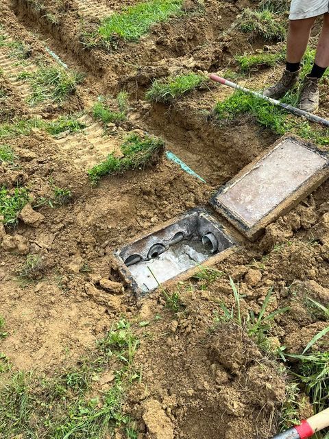 Person digging a hole in the ground with a shovel - Campbellsburg, IN | Twisted Electric LLC 