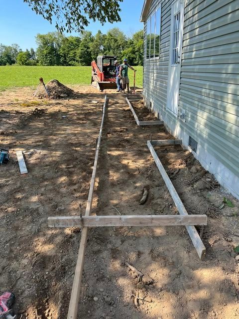 Group of men standing in the dirt in front of a house - Campbellsburg, IN | Twisted Electric LLC 
