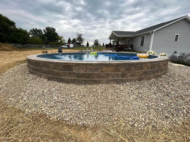 Swimming pool sitting on top of a pile of gravel in front of a house - Campbellsburg, IN | Twisted Electric LLC 