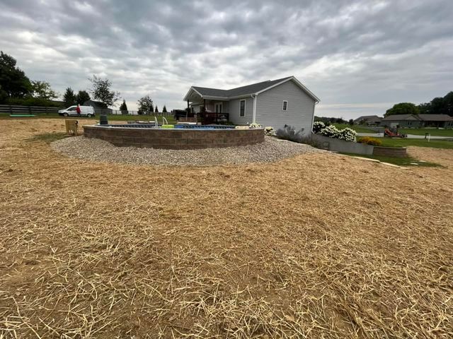 House is sitting on top of a hill next to a large pile of hay - Campbellsburg, IN | Twisted Electric LLC 