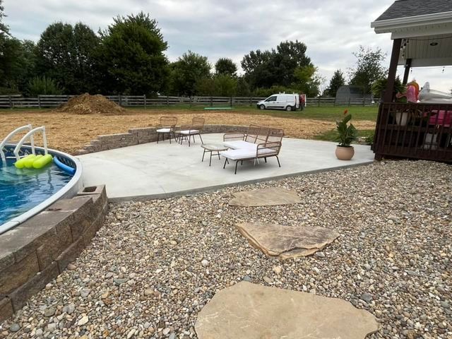 Swimming pool in the backyard with a patio area in front of it - Campbellsburg, IN | Twisted Electric LLC 