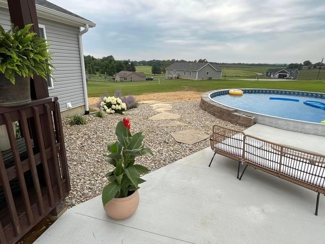 Potted plant sitting on a patio next to a swimming pool - Campbellsburg, IN | Twisted Electric LLC 