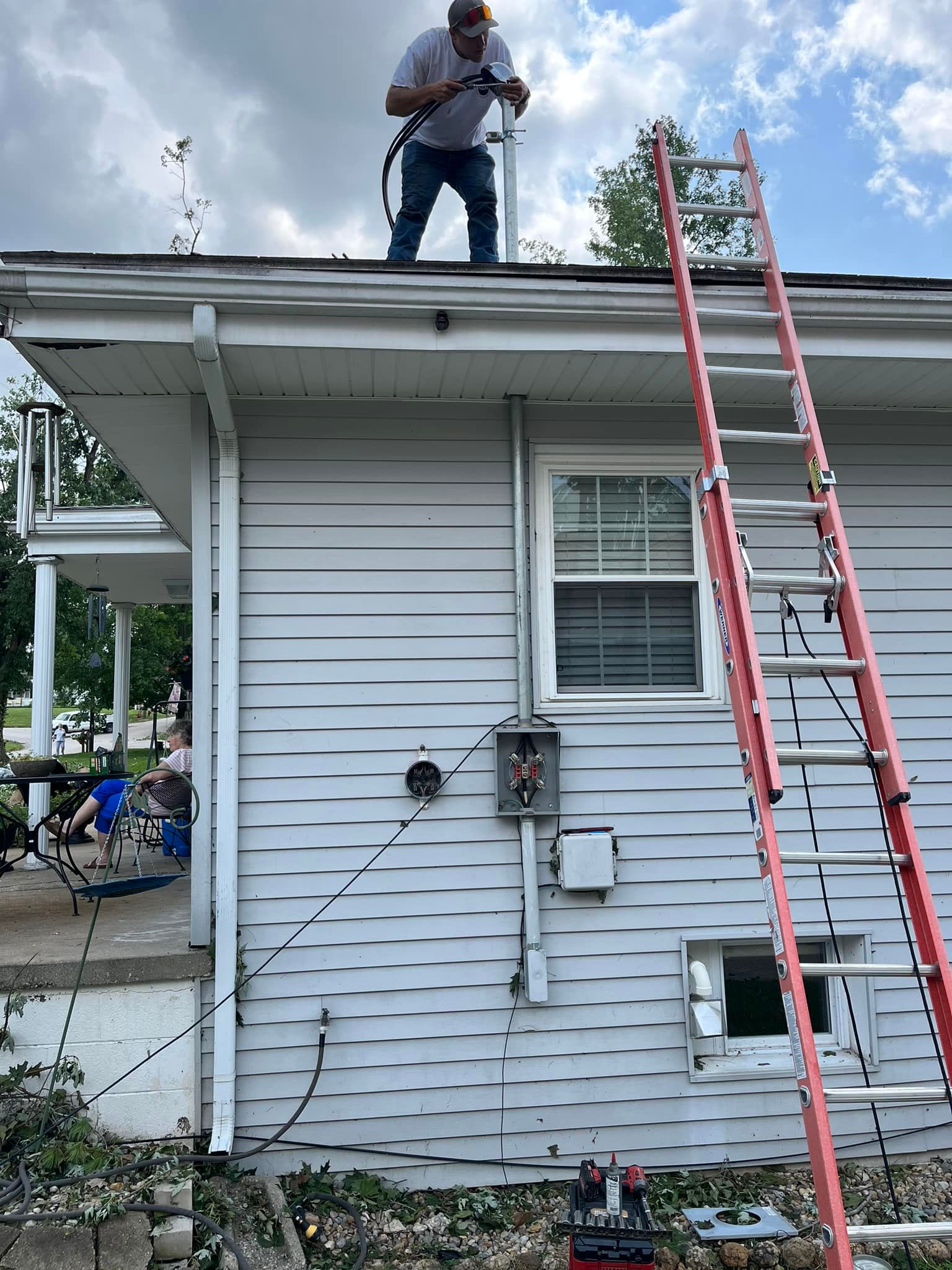Man Fixing House Wires — Campbellsburg, IN — Twisted Electric LLC