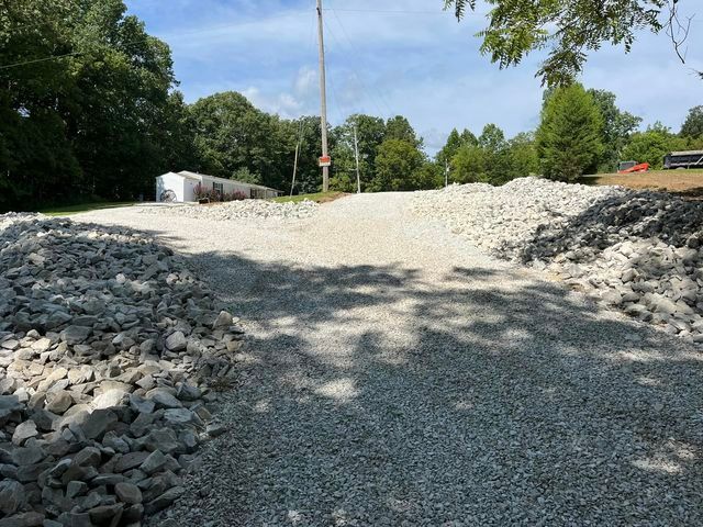 Pile of gravel sitting on the side of a road - Campbellsburg, IN | Twisted Electric LLC 