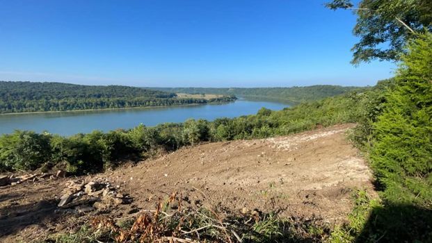 Large body of water surrounded by trees on a hillside - Campbellsburg, IN | Twisted Electric LLC 
