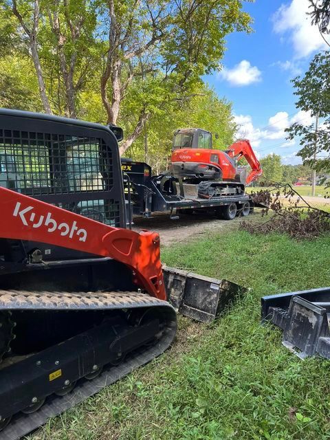 Bulldozer being towed by a tractor on a trailer - Campbellsburg, IN | Twisted Electric LLC 