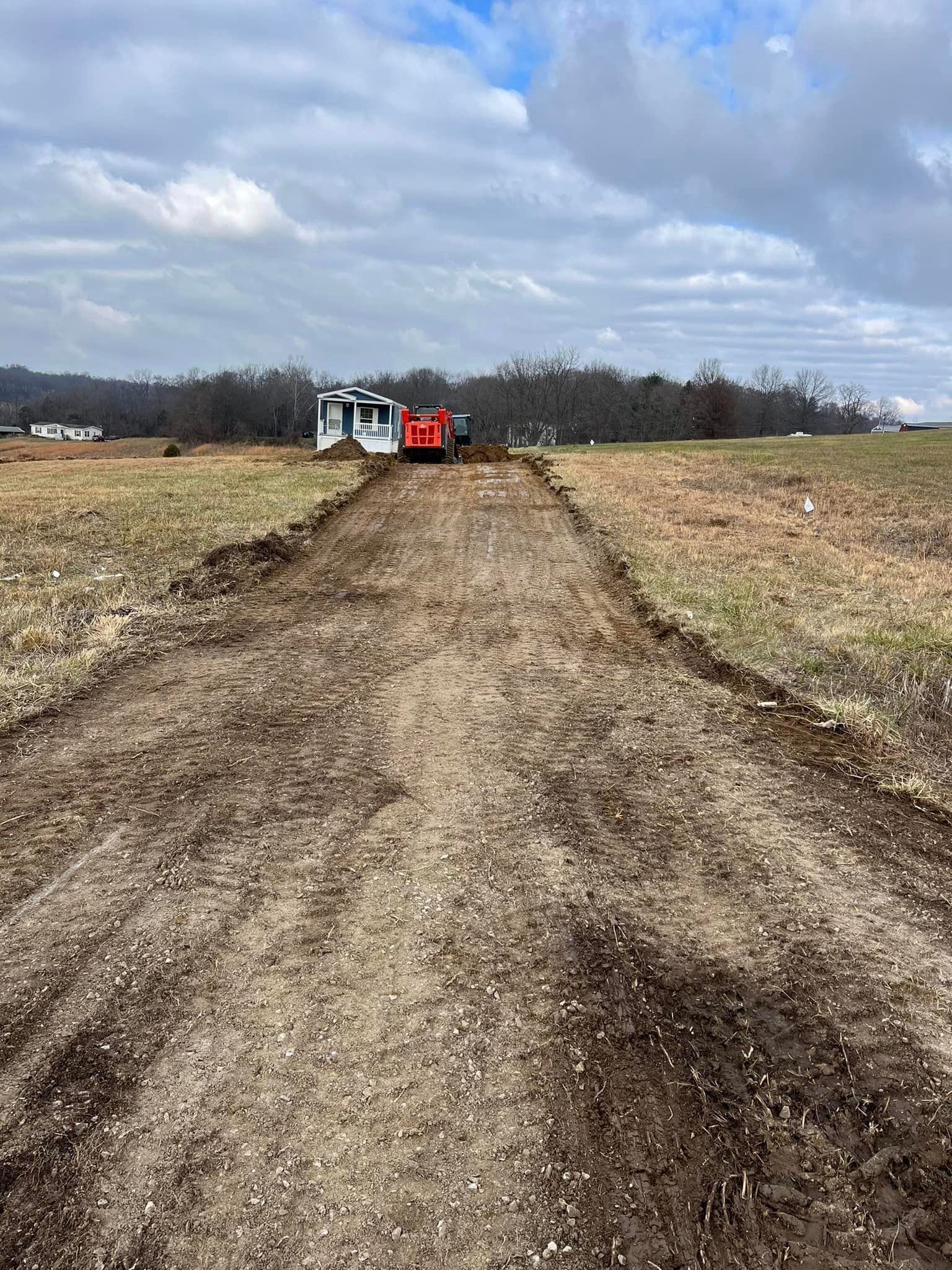 Dirt Road With A Tractor In The Background — Campbellsburg, IN — Twisted Electric LLC