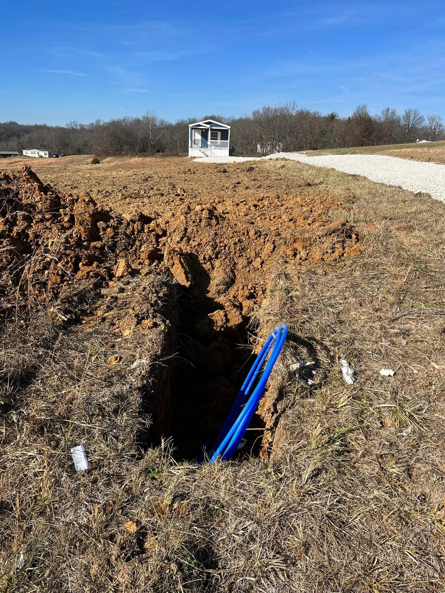 Blue Hose Lying Beside A Hole In The Dirt — Campbellsburg, IN — Twisted Electric LLC