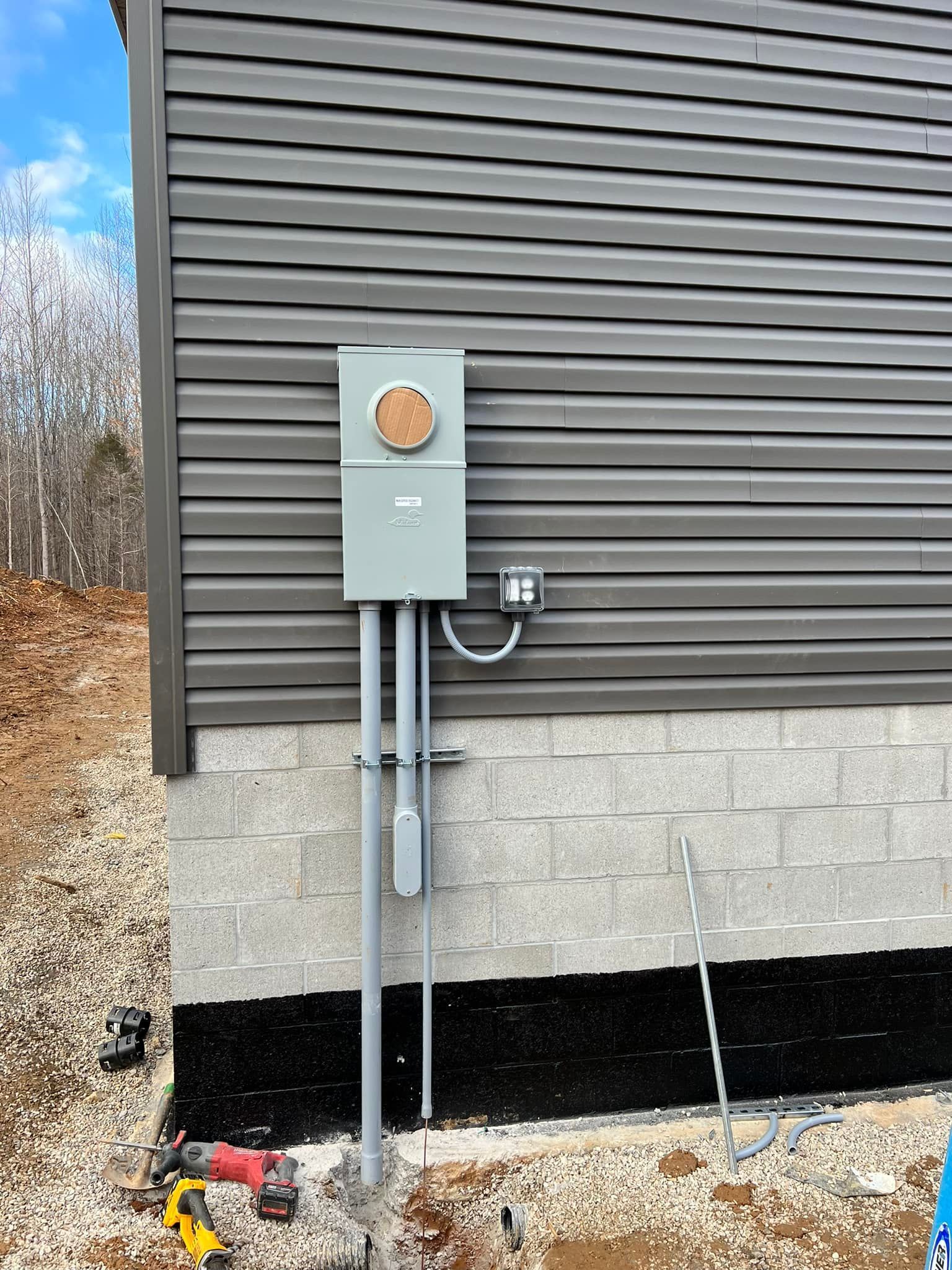 An electrical box is attached to the side of a house | Campbellsburg, IN | Twisted Electric LLC