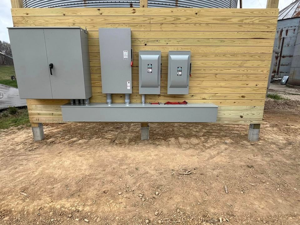 A wooden building with a lot of electrical boxes on it | Campbellsburg, IN | Twisted Electric LLC