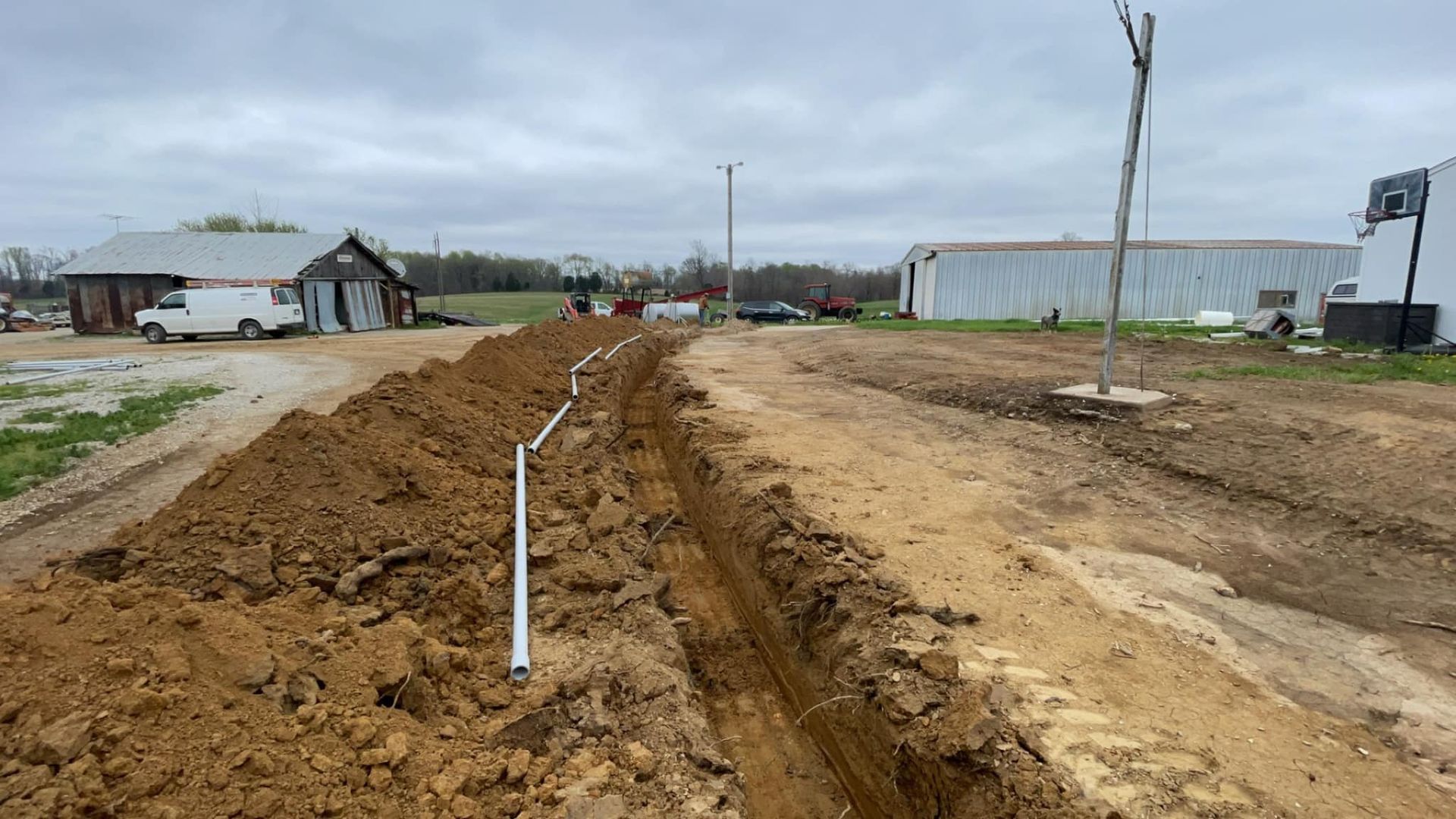 A dirt road with a pipe in the middle of it | Campbellsburg, IN | Twisted Electric LLC