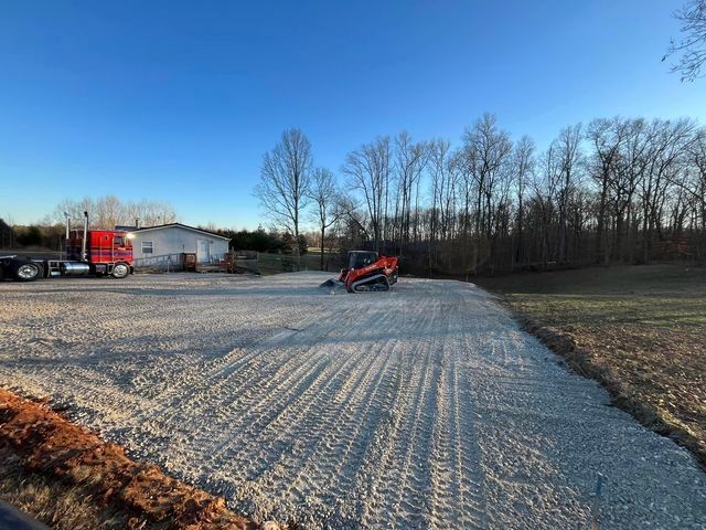 Truck parked in a gravel lot next to a bulldozer - Campbellsburg, IN | Twisted Electric LLC 