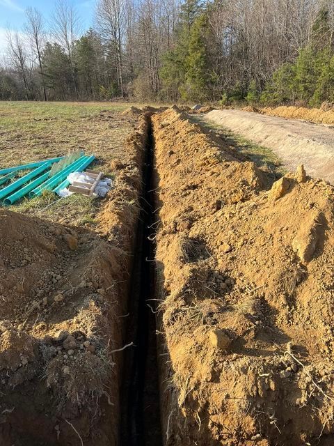 Trench being dug in the dirt next to a road - Campbellsburg, IN | Twisted Electric LLC 