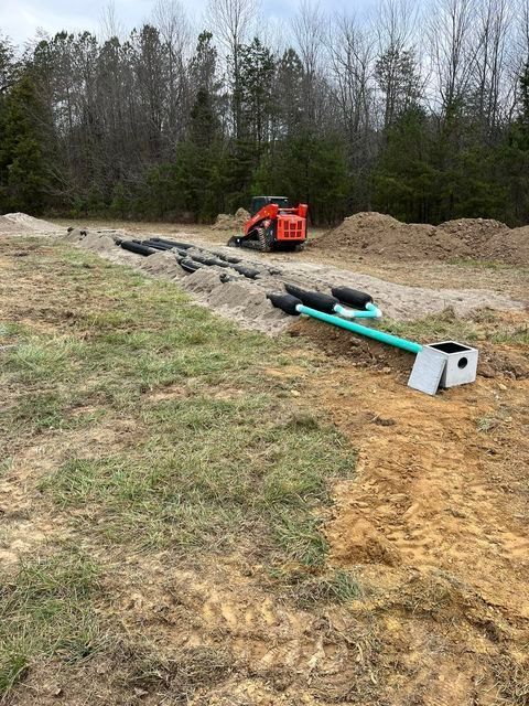 Red bulldozer digging a hole in the dirt in a field - Campbellsburg, IN | Twisted Electric LLC 