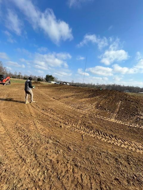 Man standing in the middle of a dirt field - Campbellsburg, IN | Twisted Electric LLC 