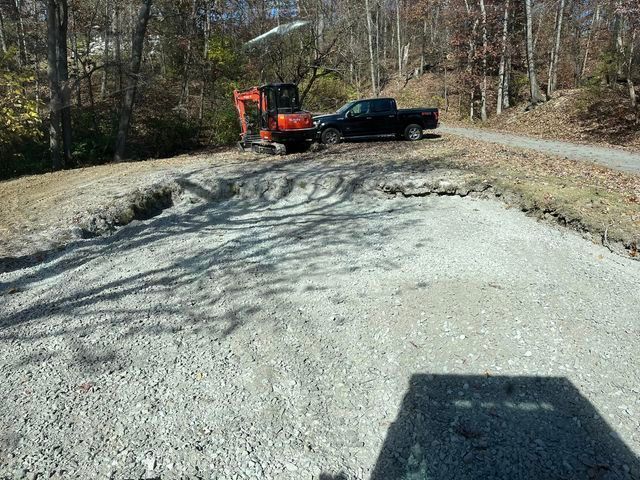 Black truck parked next to a small excavator on a gravel road - Campbellsburg, IN | Twisted Electric LLC 
