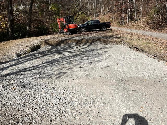 Black truck parked next to a small excavator on a gravel road - Campbellsburg, IN | Twisted Electric LLC 