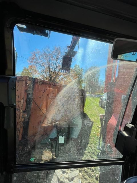 Close up of a dirty window of a bulldozer - Campbellsburg, IN | Twisted Electric LLC 