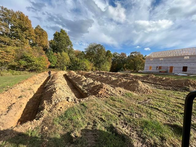 Large pile of dirt sitting in a field in front of a house under construction - Campbellsburg, IN | Twisted Electric LLC 