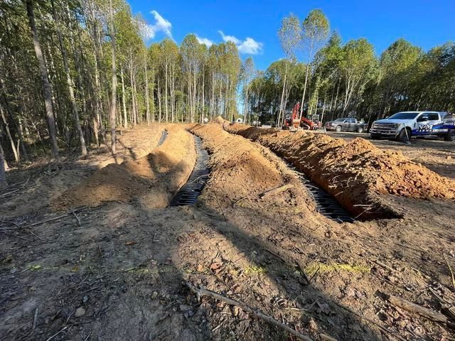 Large pile of dirt sitting in the middle of a forest - Campbellsburg, IN | Twisted Electric LLC 