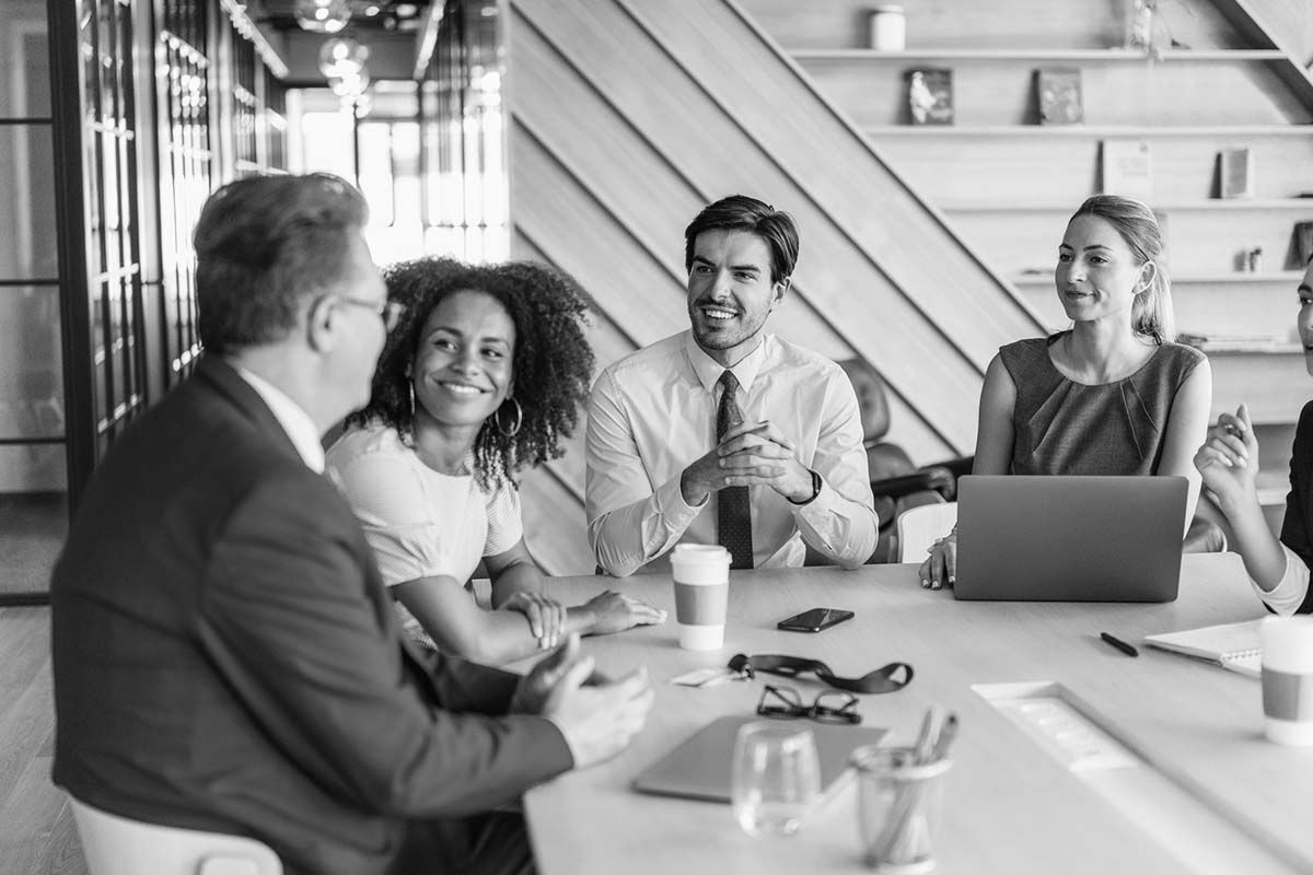 Clients meeting and discussing the services the Social Intelligence Group provides.