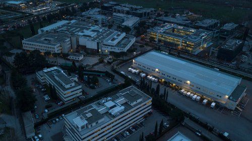 An aerial view of an industrial complex with new asphalt in Columbus Ohio an a freshly painted ADA parking spot in an asphalt parking lot