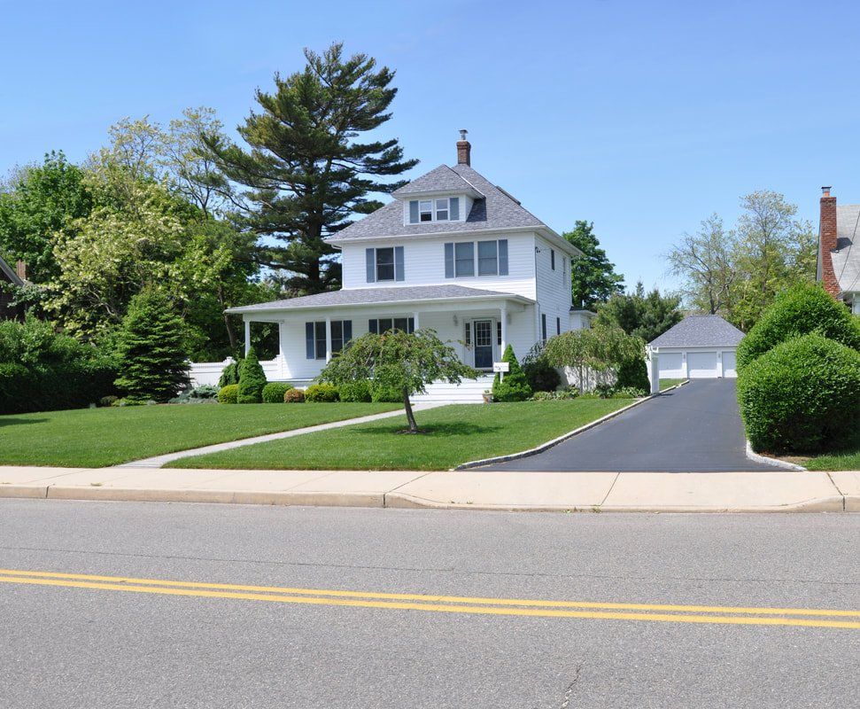 A white home with freshly paved driveway in grandview ohio