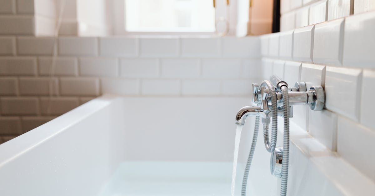 A bathtub with water coming out of it in a bathroom.