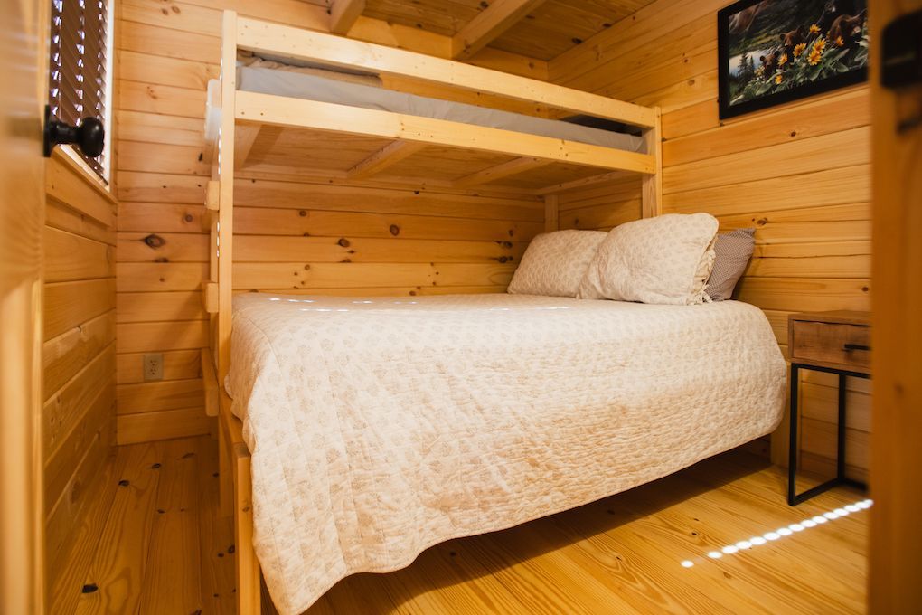 There is a bunk bed in the corner of the room.