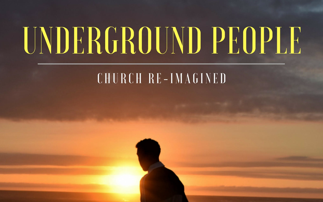 A man standing in front of a sunset with the title underground people