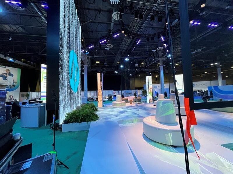 Sumitomo Tire displaying their products on top of a Smartstage revolve. Spinning heavy duty display systems are our specialty and our logistics team provides a large catalog of large rotating staging.