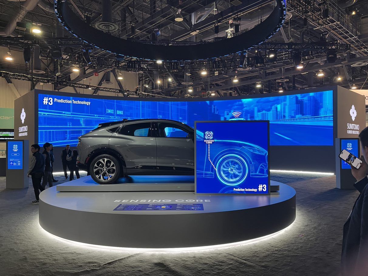 Sumitomo Tire displaying their products on top of a Smartstage revolve. Spinning heavy duty display systems are our specialty and our logistics team provides a large catalog of large rotating staging.