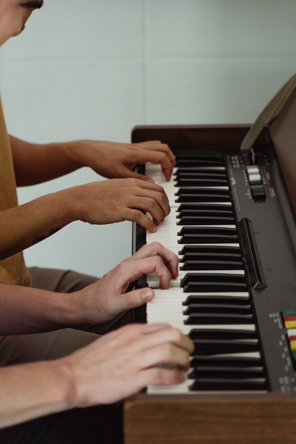 Playing a Piano together — Piano Tuner Near Me in Forster, NSW