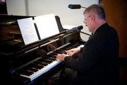 Don Ober playing piano for his local church-Trenton, New Jersey