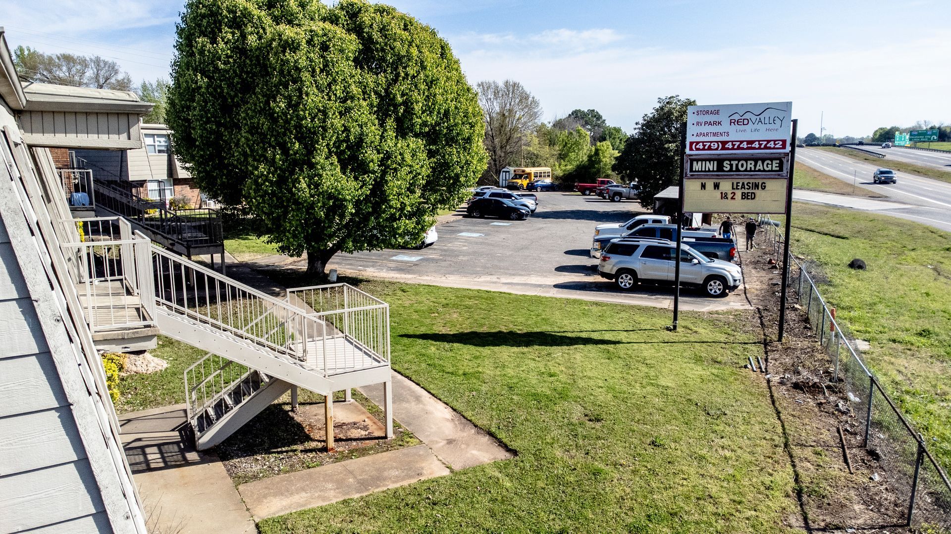 An aerial view of a parking lot with stairs leading up to it.