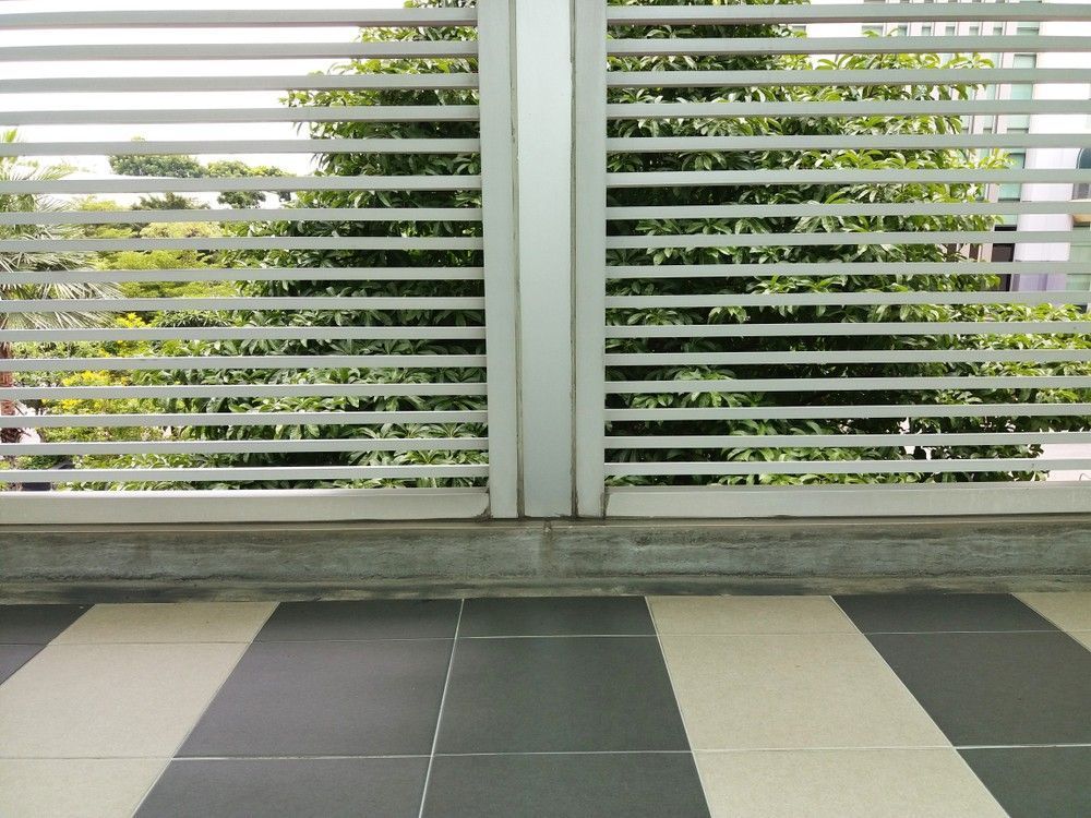 A Black And White Striped Floor With A Fence In The Background — Northern Glazing Glass & Aluminium In Smithfield, QLD