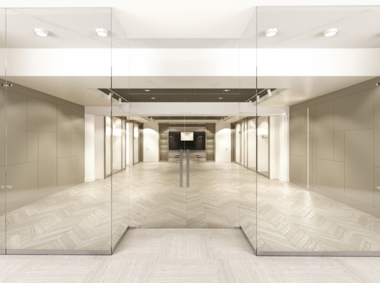 A Hallway With A Lot Of Glass Doors Leading To A Room — Northern Glazing Glass & Aluminium In Smithfield, QLD